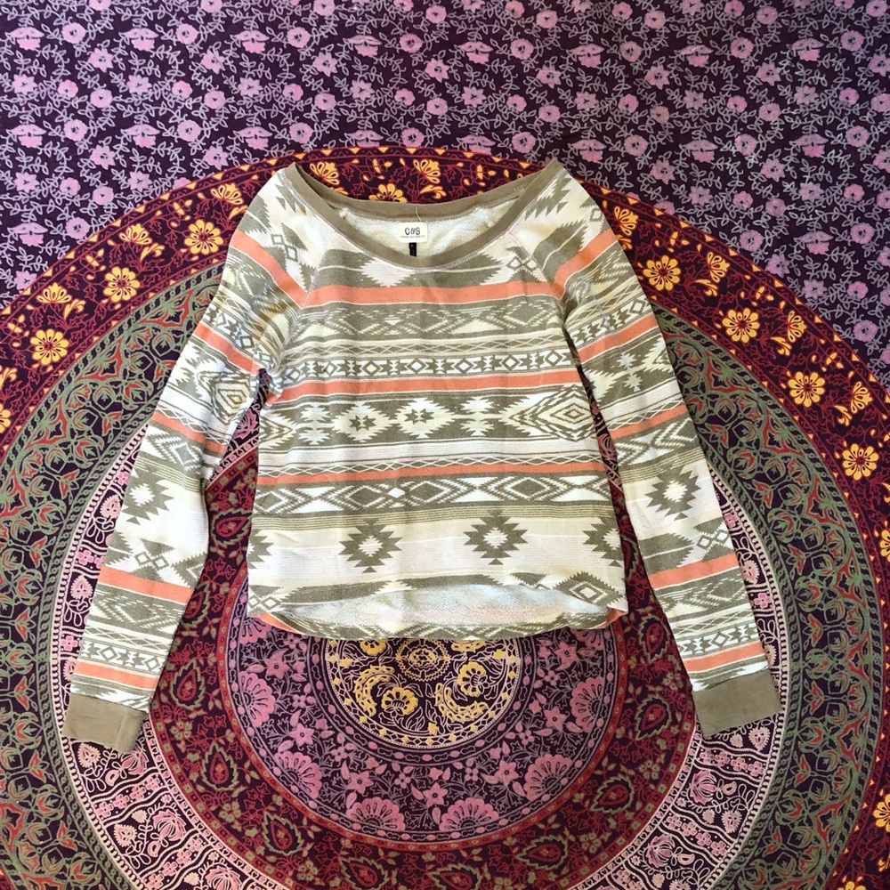 White tan and brown small pullover shirt.